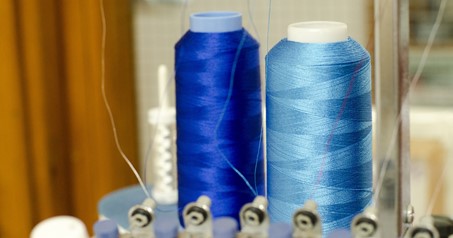 Spools of UV resistant thread used for marine upholstery stitching